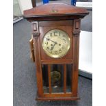 An early 20th century mahogany wall clock with silvered dial