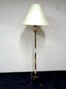 A brass and onyx standard lamp with shade