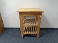 A pine kitchen butcher's block trolley