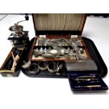 A tray containing coffee grinder, canteen of cutlery, boxed pipe,