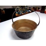 A 19th century copper cast iron handled jam pan