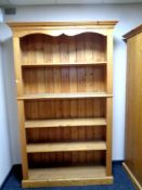 A set of pine open bookshelves, width 125 cm including cornice,