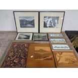 A box containing framed monochrome photographs, alpine scenes, two marquetry panels,