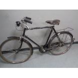 A vintage gent's Raleigh humber bike with a leather Brooks saddle