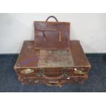 Two antique leather luggage cases together with a leather briefcase