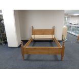 A contemporary pine 5 ft bed frame with mattress slats