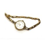 A 9ct gold lady's Vertex wristwatch on 9ct gold expansion strap, 15.