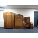 A three piece walnut Art Deco bedroom suite together with similar bedside cabinet