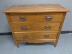 An Edwardian oak three drawer chest