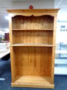 A set of pine open bookshelves, width 125 cm including cornice,