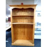 A set of pine open bookshelves, width 125 cm including cornice,