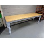 A pine topped refectory dining tables on painted bases, length 240 cm,