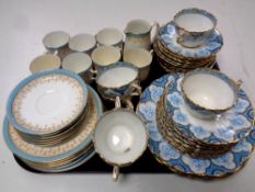 A tray containing 27 pieces of blue and white gilt rimmed bone tea china together with a further