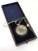 A continental silver pocket watch with key