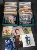 Two boxes containing a large quantity of vinyl LPs and 12 inch singles to include Abba,