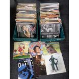 Two boxes containing a large quantity of vinyl LPs and 12 inch singles to include Abba,