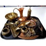 A tray of copper and brass ware including circular tray, eastern dishes and vases, copper jug,