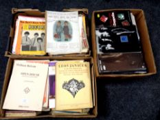 Three boxes containing sheet music and song books