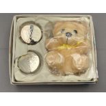 A baby's gift set containing teddy bear,