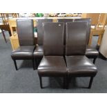 A set of twelve contemporary high backed brown leather dining chairs