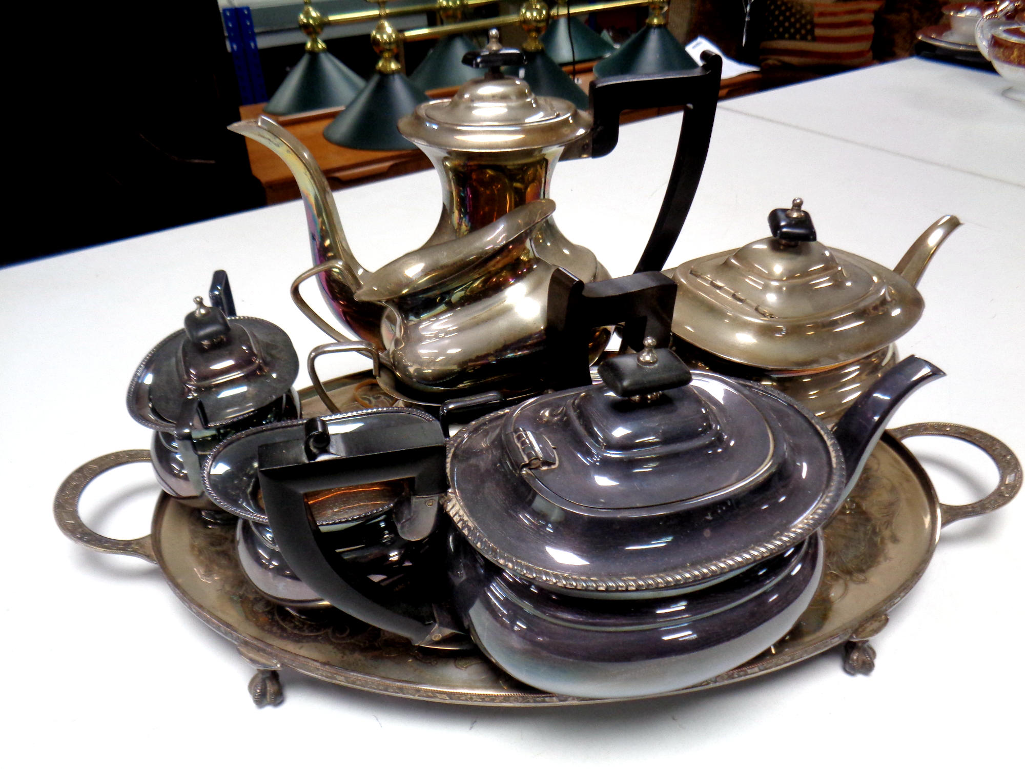 Two Sheffield plate tea services on a twin handled serving tray