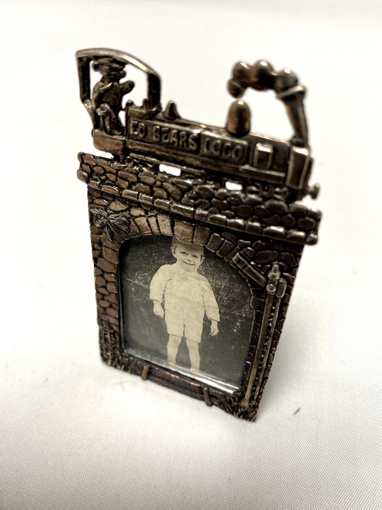 A small silver plated photograph frame