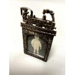 A small silver plated photograph frame