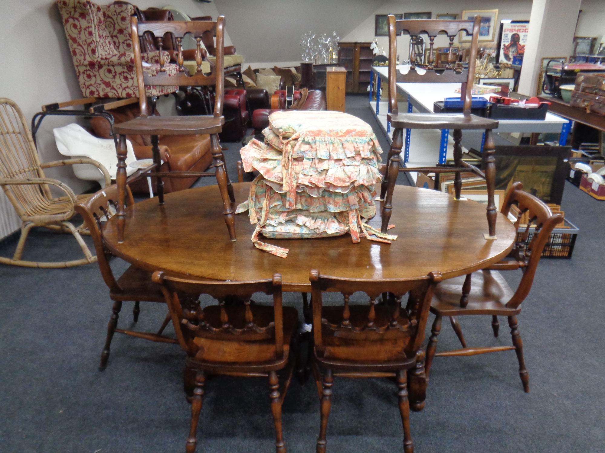 A good quality Titchmarsh and Goodwin oak oval dining table together with a set of eight dining