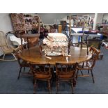 A good quality Titchmarsh and Goodwin oak oval dining table together with a set of eight dining