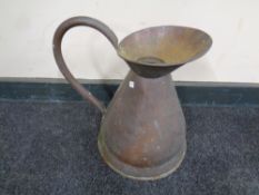 An antique copper two gallon jug