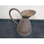 An antique copper two gallon jug