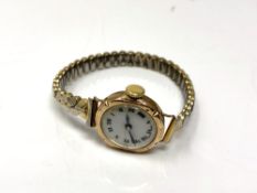 An antique 9ct gold lady's wristwatch on expansion bracelet