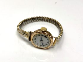 An antique 9ct gold lady's wristwatch on expansion bracelet