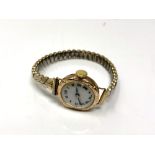 An antique 9ct gold lady's wristwatch on expansion bracelet