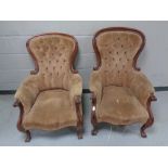 A pair of Victorian mahogany framed armchairs upholstered in a brown button dralon