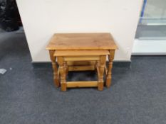 A nest of two pine tables