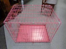 A folding metal dog cage