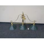 A brass three way snooker table light with glass shades