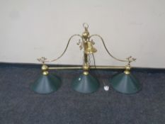A brass three way snooker table light with glass shades