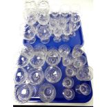 Two trays containing a quantity of cut glass lead crystal drinking glasses to include Stuart
