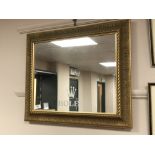 A gilt framed mirror 'Rolex', inscribed verso 'Goldsmiths Notts',