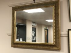 A gilt framed mirror 'Rolex', inscribed verso 'Goldsmiths Notts',