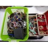 A basket and a jewellery box containing a large quantity of assorted jewellery