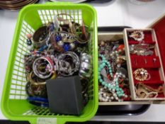 A basket and a jewellery box containing a large quantity of assorted jewellery