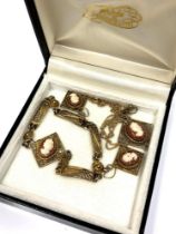 An early 20th century suite of cameo jewellery to include filigree bracelet,