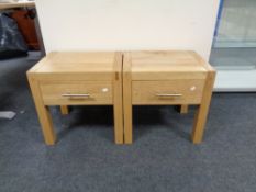 A pair of contemporary oak lamp tables fitted a drawer