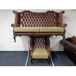 A brown button leather Chesterfield wingback settee with matching armchair