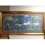 An oriental silk needlework panel depicting herons in gilt frame