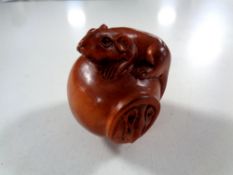 A carved Chinese hardwood netsuke,