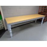 A pine topped refectory dining tables on painted bases, length 240 cm,